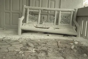 Javan Prints: Ash covered seat outside house damaged from recent volcanic eruption