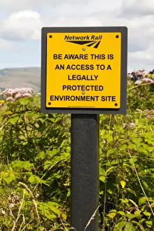 Site Prints: Be Aware This Is An Access To A Legally Protected Environment Site sign warning railworkers that track crosses through