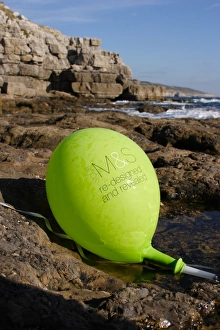 Pollution Prints: Balloon washed up on rocky shore, Dancing Ledge, Dorset, England, october