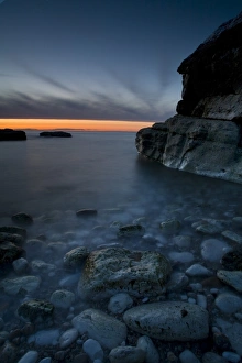 Pebbles Prints: Bay with pebbles on beach, on chalk headland at sunset