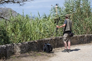 Pastime Prints: Birdwatcher with telescope overlooking marshland