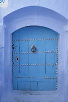 Moroccan Prints: Blue door in street of city, Chefchaouen, Morocco, april