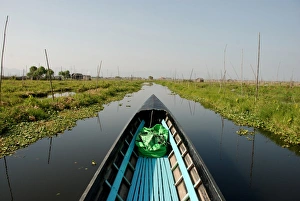 Canoe Prints: Boat in channel between floating vegetable gardens