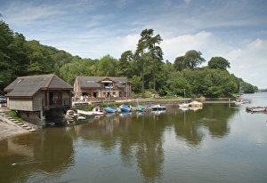 Trending: Boathouse and boats at edge of reservoir