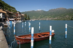 Harbours Prints: Boats in harbour of town on lake island