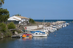 Jetty Prints: Boats and jet skis moored at jetty
