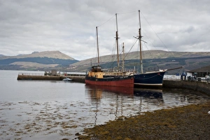 Jetty Prints: Boats moored at jetty on shore of sea loch