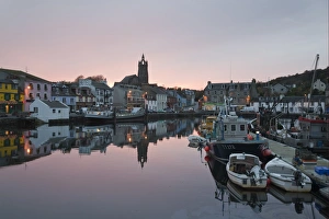 Trending: Boats moored in town harbour at sunset