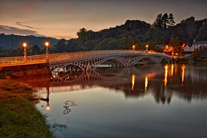 Trending: Bridge over river during high tide at dusk