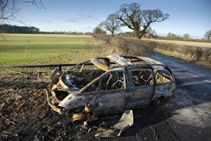 Cars Prints: Burnt-out vehicle in farm gateway, Skipwith, North Yorkshire, England, january