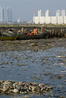 Javan Prints: Children on boat in rubbish filled water