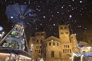 Christmas Prints: Christmas pyramid and market during snowfall at night