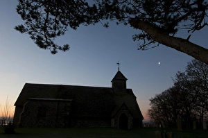 Sun Rise Prints: Church silhouetted at dawn, Harty Church, Harty, Isle of Sheppey, Kent, England, january