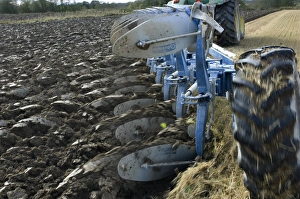 Furrows Prints: Close-up of eight furrow reversible plough pulled by tractor