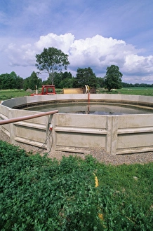 Muck Prints: Concrete sided slurry lagoon on farm, Sweden