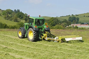 Organic Prints: Contractor with John Deere tractor and Cls mower