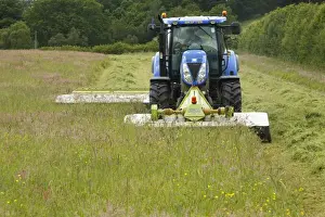 Organic Prints: Contractor with New Holland T6080 tractor with front and rear mounted Cls mowers