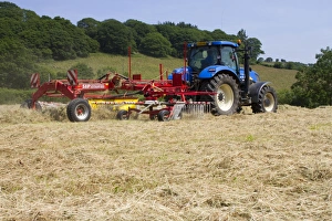 Powys Prints: Contractor with New Holland T7030 tractor and SIP hay rake
