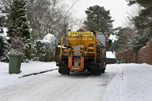 Lorries Prints: Council gritter lorry gritting snow covered residential road, Surrey, England, January
