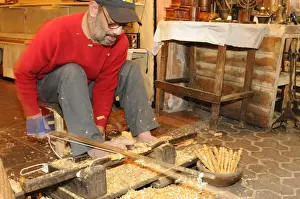 Carving Prints: Craftsman working Atlas Cedar (Cedrus atlantica) wood on lathe, Morocco, january