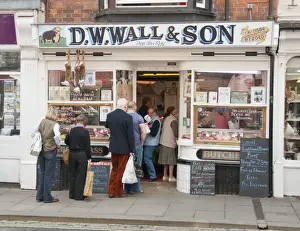 Game Prints: Customers queueing outside traditional butcher's shop