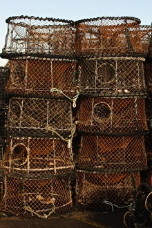 Quay Prints: Cuttlefish pots on quayside, West Bay, Dorset, England, january