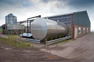 Tank Prints: Dairy farming, bulk milk tank outside rotary parlour, Dumfries, Scotland, march