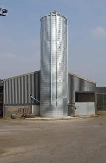 Dairys Prints: Dairy farming, metal feed bin on dairy farm, Lancashire, England, April