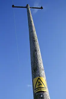 Dangerous Prints: Danger of Death warning sign, on pole of overhead powerlines, Suffolk, England, october