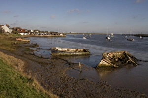 Orford Prints: Decaying old boats on mud in The River Alde by Orford, Suffolk