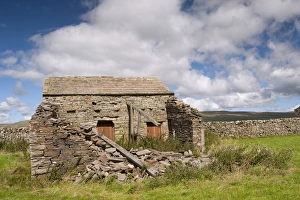 : Derelict stone barn in farmland