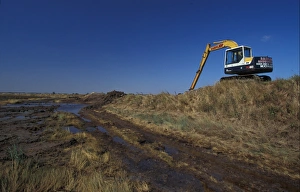 Defence Prints: Digger working on the sea wall at Tollesbury - Essex