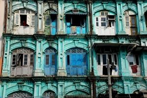 Colonial Prints: Dilapidated colonial era tenement block in city, Central Yangon, Myanmar, January