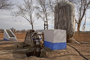 Supply Prints: Disused well and old vats for collecting rainwater on vineyard, La Mancha, Spain