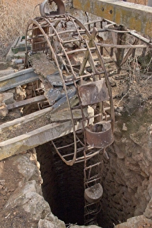 Supply Prints: Disused well on vineyard, La Mancha, Spain, february