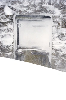 Blizzard Prints: Doors on stone field barn behind snowdrift during snowstorm, Cumbria, England, March