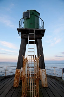 Town Prints: Early 20th century wooden lighhouse at end of pier