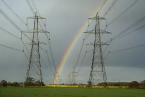 Oilseed Prints: Electricity transmission pylons and rainbow