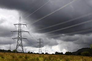 Storm Prints: Electricity transmission pylons and stormclouds