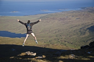 Jump Prints: Fell runner jumping over rock (imitating base jump)