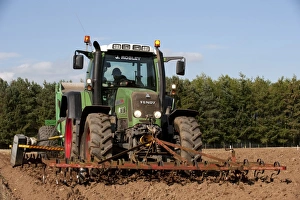 Stones Prints: Fendt 716 tractor with stone picker, going over newly ploughed field, England, september