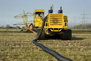 Drain Prints: Field drainage, continuous pipe laying machine working in arable field
