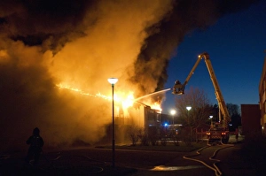 Vehicle Prints: Fire in block of flats, firemen with hose and fire engine, Tierp, Uppsala, Sweden