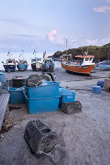 Industry Prints: Fishing boats moored on shingle beach in evening sunlight