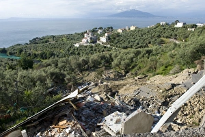 Flood Prints: Flood damaged coastal road through olive groves and farmland