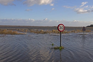 Flood Prints: Flooded coast road and marshes after tidal surge
