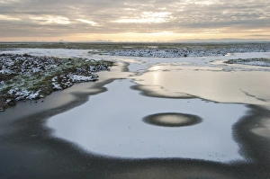 Floods Prints: Frozen flooded grazing marsh and snow