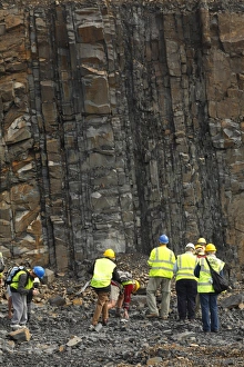 Quarry Prints: Geologists looking at quarry face