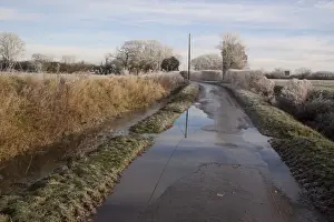 Flooding Prints: After heavy rain the field ditches have over flowed and flooded a Suffolk country lane