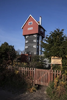 The House in the Clouds is a water tower at Thorpeness, Suffolk, UK. It was built in 1923 to receive water pumped